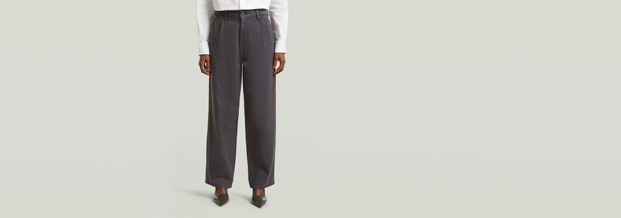 pantaloni larghi a pieghe
