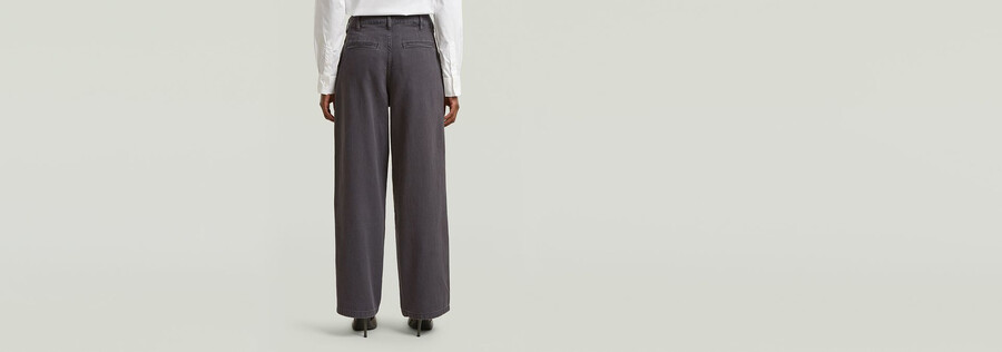 pantaloni larghi a pieghe