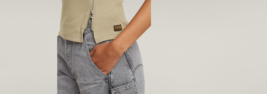 canotta aderente con zip asimmetrica