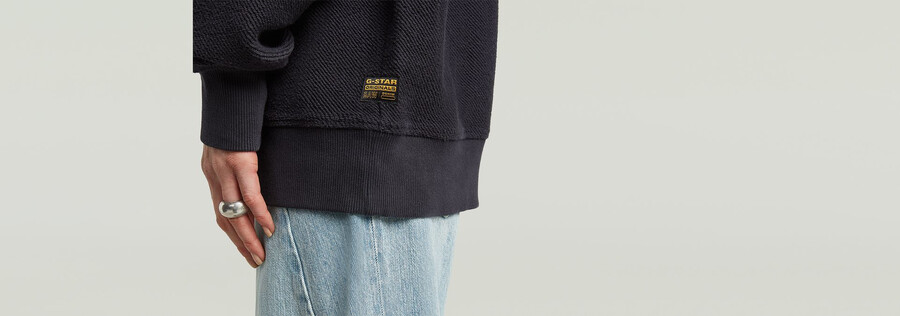 maglione oversize con tasche miste