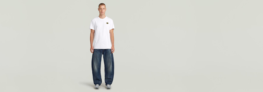 jeans larghi piegati