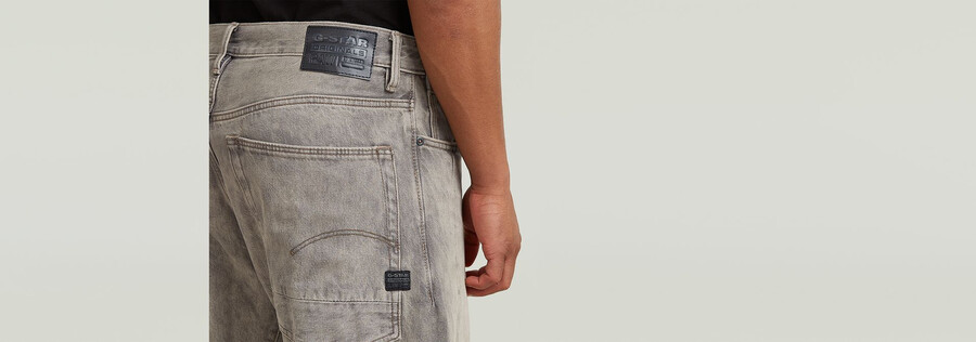 jeans larghi piegati