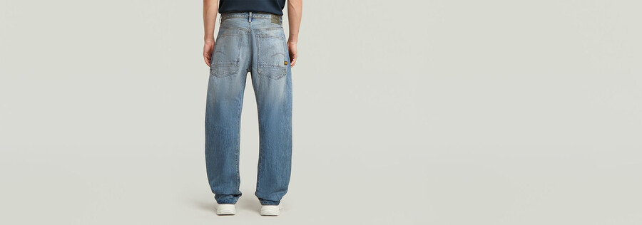 jeans larghi piegati