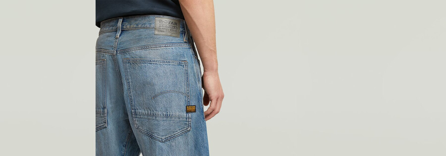 jeans larghi piegati