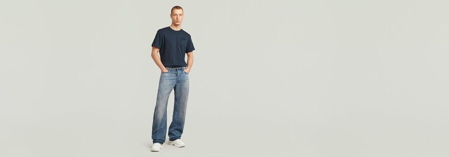 jeans larghi piegati
