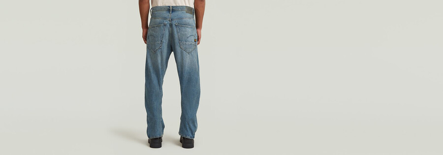 jeans larghi ad arco
