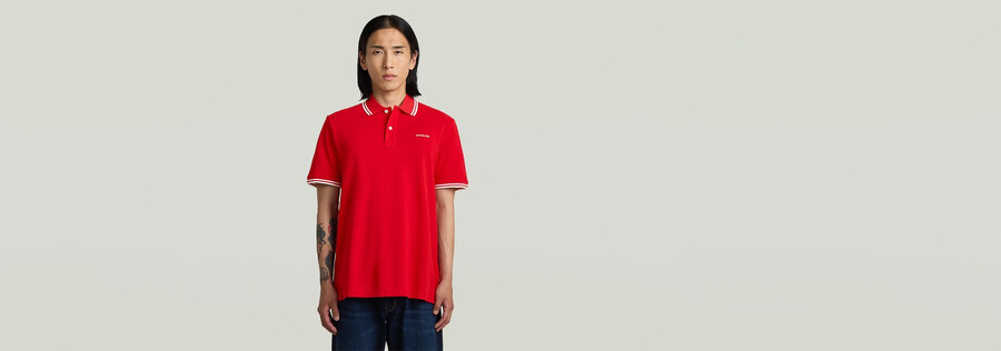 polo a righe con logo sul petto