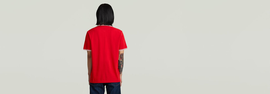 polo a righe con logo sul petto