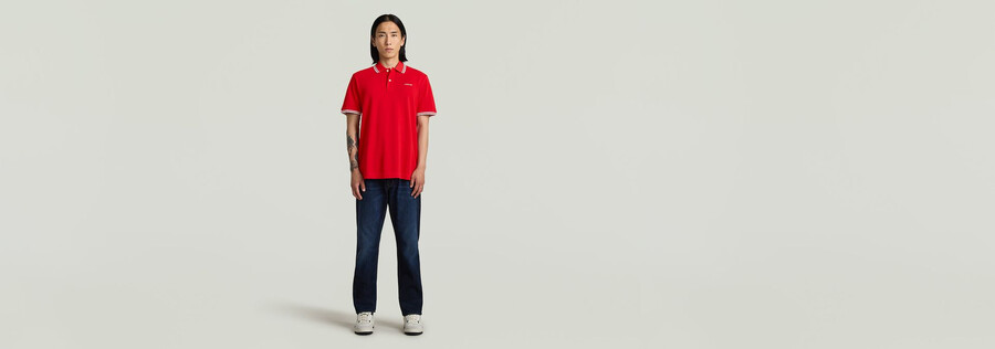polo a righe con logo sul petto