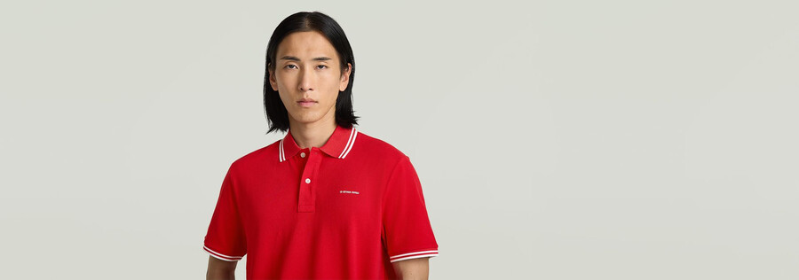 polo a righe con logo sul petto
