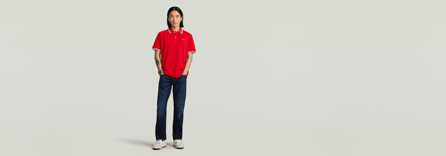 polo a righe con logo sul petto