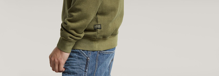 maglione lavato con logo g distrutto