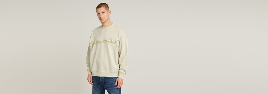 maglione largo in ciniglia con scritta g