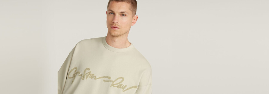 maglione largo in ciniglia con scritta g