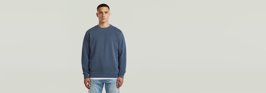 maglione con logo sovratinto
