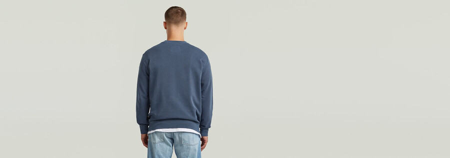 maglione con logo sovratinto
