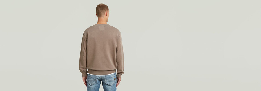 maglione con logo sovratinto